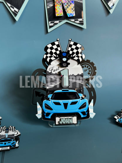 Blue car design with checkered flags and 'Fast 1' text on a blue background, featuring the brand 'LEMAK TOPPERS'.